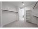 Spacious walk-in closet with ample storage and a view to the bathroom and shelving at 12316 W Wagon Wheel Dr, Glendale, AZ 85307