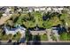 Expansive property with mature trees, a swimming pool, and a charming single-story home outlined with a yellow property line at 125 N Fraser E Dr, Mesa, AZ 85203