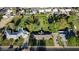Expansive property with mature trees, a swimming pool, and a charming single-story home outlined with a yellow property line at 125 N Fraser E Dr, Mesa, AZ 85203
