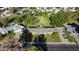 Spacious yard with mature trees and shrubs surrounding a well maintained single story home featuring a long roofline at 125 N Fraser E Dr, Mesa, AZ 85203