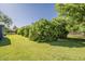 Expansive backyard featuring lush green grass and mature landscaping at 125 N Fraser E Dr, Mesa, AZ 85203