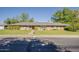 Charming single-story home with a well-maintained lawn and landscaping, showcasing curb appeal and a welcoming facade at 125 N Fraser E Dr, Mesa, AZ 85203