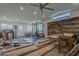 Gym with weight rack, natural light, and sliding wood doors at 125 N Fraser E Dr, Mesa, AZ 85203