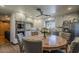 Bright kitchen with stainless appliances, custom cabinets, and a cozy breakfast nook at 125 N Fraser E Dr, Mesa, AZ 85203