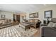 Bright living room features hardwood floors, comfortable seating, and decorative accents for a welcoming ambiance at 125 N Fraser E Dr, Mesa, AZ 85203