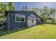 Charming outbuilding boasting custom barn doors with an Arizona-themed starburst at 125 N Fraser E Dr, Mesa, AZ 85203