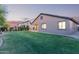 Beautiful backyard featuring lush green grass and a well-maintained landscape, perfect for outdoor activities and relaxation at 14556 W Shaw Butte Dr, Surprise, AZ 85379