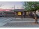 Charming single-story home featuring a well-maintained yard and a two-car garage at 14556 W Shaw Butte Dr, Surprise, AZ 85379