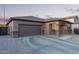 Beautiful single-story home with a two-car garage and well-kept landscaping at 14556 W Shaw Butte Dr, Surprise, AZ 85379