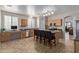 Bright kitchen with light wood cabinetry, island seating and stainless steel appliances at 14556 W Shaw Butte Dr, Surprise, AZ 85379