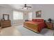 Main bedroom with natural light, dresser and carpeted floor at 14556 W Shaw Butte Dr, Surprise, AZ 85379