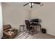 Functional home office featuring a comfortable chair, workspace, and a cozy seating area at 14556 W Shaw Butte Dr, Surprise, AZ 85379