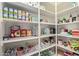 Walk-in pantry with abundant shelving for optimal storage at 14556 W Shaw Butte Dr, Surprise, AZ 85379