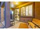 Covered patio featuring a bench and side table for outdoor relaxation and leisure at 14556 W Shaw Butte Dr, Surprise, AZ 85379