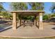 Covered picnic area with stone columns and seating offers a relaxing outdoor space at 14556 W Shaw Butte Dr, Surprise, AZ 85379