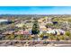 Aerial view of commercial area with various stores, office buildings and restaurants in a scenic area at 15212 N 53Rd St, Scottsdale, AZ 85254