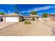 Charming single-story home with a two-car garage, solar panels, desert landscaping, and a well-maintained exterior at 15212 N 53Rd St, Scottsdale, AZ 85254