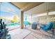 Back patio with shaded seating, a waterfall feature, and a refreshing inground swimming pool at 17225 N 51St Dr, Glendale, AZ 85308