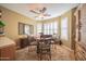 Bright breakfast nook with windows and tile floors, ceiling fan, with seating for four at 17225 N 51St Dr, Glendale, AZ 85308