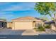 Inviting single-Gathering home featuring a two-car garage, desert landscaping, and a well-maintained exterior at 17225 N 51St Dr, Glendale, AZ 85308