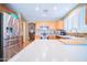 Bright kitchen featuring stainless steel appliances, tile backsplash, and ample counter space at 17225 N 51St Dr, Glendale, AZ 85308