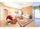 Comfortable living room with lots of natural light, hardwood floors, and a neutral color palette at 17225 N 51St Dr, Glendale, AZ 85308