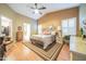 Spacious main bedroom with hardwood floors, vaulted ceilings, and ample natural light at 17225 N 51St Dr, Glendale, AZ 85308