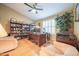 Inviting office space with a vaulted ceiling, ceiling fan, and desk with lots of shelving at 17225 N 51St Dr, Glendale, AZ 85308