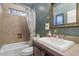 Bathroom with a bathtub, shower, toilet and a large mirror over the sink at 1788 W Dion Dr, Anthem, AZ 85086