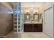 Bathroom featuring dual sinks, tile floors, walk-in shower with glass block at 1788 W Dion Dr, Anthem, AZ 85086