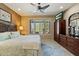 Bedroom features a view of the golf course, a ceiling fan, and window shutters at 1788 W Dion Dr, Anthem, AZ 85086
