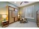 Bedroom with an accent murphy bed, ceiling fan, and window shutters at 1788 W Dion Dr, Anthem, AZ 85086