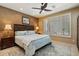 Bedroom features a ceiling fan, window shutters and a patterned accent rug at 1788 W Dion Dr, Anthem, AZ 85086