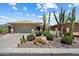 A beautiful house with desert landscaping features various cacti and native plants at 1788 W Dion Dr, Anthem, AZ 85086