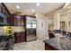 Gourmet kitchen boasts stainless steel appliances, custom cabinets, and granite countertops at 1788 W Dion Dr, Anthem, AZ 85086