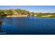 Scenic pond with waterfall feature next to the golf course at 1788 W Dion Dr, Anthem, AZ 85086
