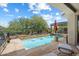 Backyard pool features a rock waterfall, mountain views and an outdoor dining area at 1788 W Dion Dr, Anthem, AZ 85086