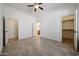 Spacious bedroom features tile floors, walk-in closet, and access to an ensuite bathroom at 17947 W Jojoba Rd, Goodyear, AZ 85338