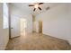 Large bedroom features tile floors, access to an ensuite bathroom and closet at 17947 W Jojoba Rd, Goodyear, AZ 85338