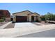 Inviting one-story home with a two-car garage, desert landscaping, and manicured curb appeal at 17947 W Jojoba Rd, Goodyear, AZ 85338