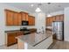 Well-equipped kitchen with stainless steel appliances, granite countertops, and ample cabinets at 17947 W Jojoba Rd, Goodyear, AZ 85338