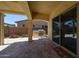 Outdoor kitchen area featuring a grill and covered patio with brick flooring at 17947 W Jojoba Rd, Goodyear, AZ 85338