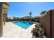 Refreshing pool and spa combination with surrounding patio and mature landscaping at 17947 W Jojoba Rd, Goodyear, AZ 85338