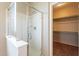 Shower and closet in a bathroom with a white shower stall at 18003 W Carmen Dr, Surprise, AZ 85388