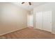 Inviting bedroom featuring closet and neutral tones at 18003 W Carmen Dr, Surprise, AZ 85388