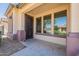 Inviting front porch with decorative security door and views of the neighborhood at 18003 W Carmen Dr, Surprise, AZ 85388