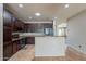 Well-designed kitchen featuring granite countertops, stainless steel appliances, and ample cabinet space at 18003 W Carmen Dr, Surprise, AZ 85388