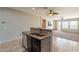 Open-concept kitchen featuring a breakfast bar with a copper sink and modern appliances at 18003 W Carmen Dr, Surprise, AZ 85388
