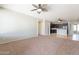 Inviting living area with a ceiling fan, providing a comfortable and airy atmosphere at 18003 W Carmen Dr, Surprise, AZ 85388