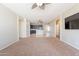 Open-concept living space flows into the kitchen, offering ample room for relaxation and dining at 18003 W Carmen Dr, Surprise, AZ 85388